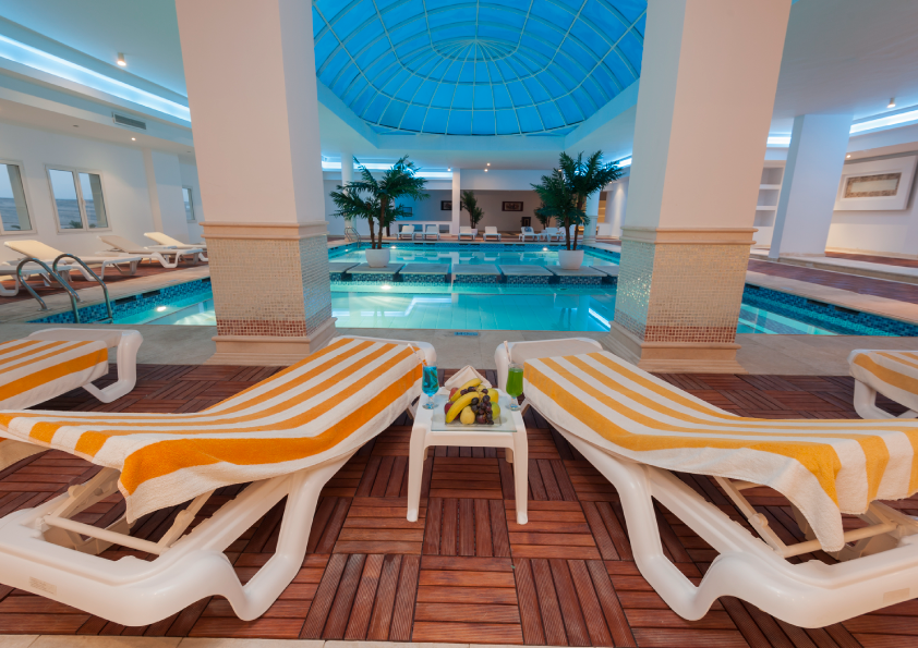 Five-star hotel indoor pool and spa with blue dome skylight